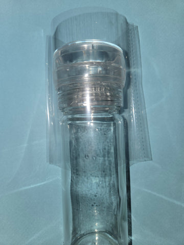 Shrink band over the top of the bottle